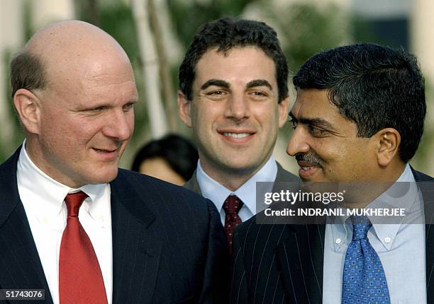 India's second largest software exporter Infosys Chief Executive Nandan Nilekani speaks with Microsoft Chief Executive Steve Ballmer as Microsoft...