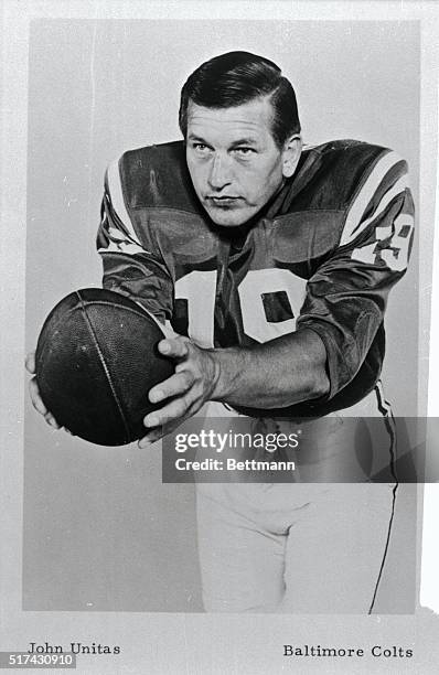 Johnny Unitas, quarterback for the Baltimore Colts, is shown in a posed action shot, as if he's about to hand off the ball.