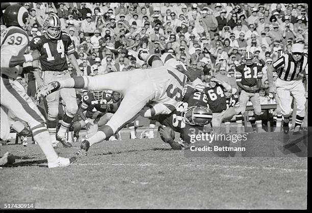 Los Angeles: Saints' Bob Gresham is knocked over for a two yard loss in this 1st quarter action as he is hit hard by Rams' David Jones. Saints is QB...