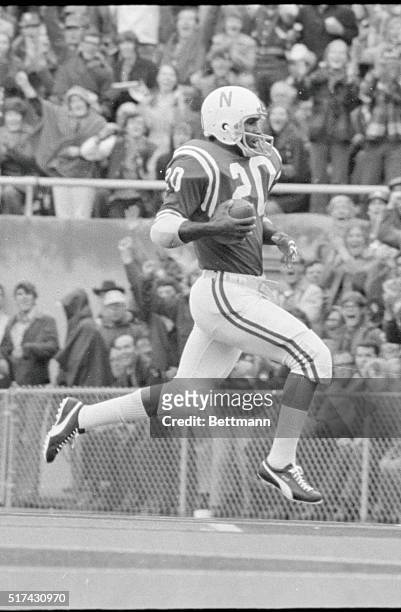 Nebraska University's halfback Johnny Rodgers sails into the end zone carrying the ball he just caught for Nebraska's first touchdown against...