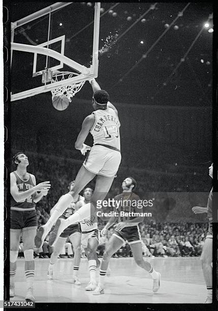 Inglewood, Calif: Lakers' Wilt Chamberlain, described as a "doubtful starter" in the fifth playoff game as a result of a sprained wrist, drives one...