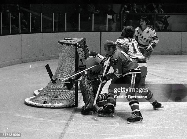 Chicago Black Hawks' Bobby Hull scores goal despite the efforts of Ranger goalie Ed Giacomin and Rod Seiling during game here, 2/9. Rangers' Jim...