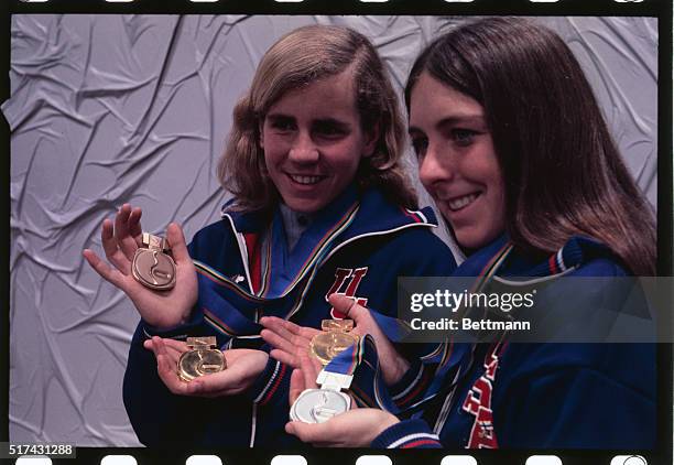 Sapporo, Japan: The U.S.A.'s Anne Henning and Dianne Holum both from Northbrook, IL, pose with their Olympic medals won in the XI Winter games. Miss...