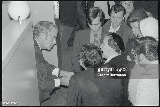 Veteran Aviator Charles A. Lindbergh, a director of Pan American World Airways Inc. Greets a stockholder at Pan Am's stockholders' annual meeting....
