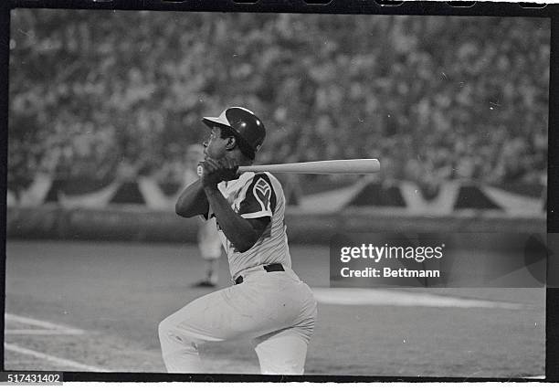 The Atlanta Braves' Hank Aaron swings away in the 6th inning of the All-Star game and drives a homer, with a man aboard, over the left field fence as...