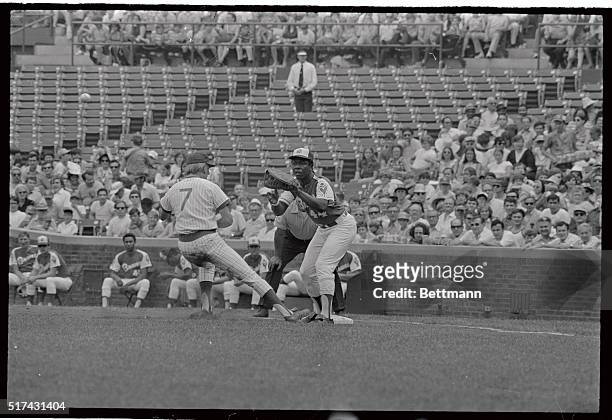 Chicago Cubs' Rick Monday beats Atlanta Braves pitcher's throw to his first baseman, Hank Aaron on pickoff attempt in first inning of game.