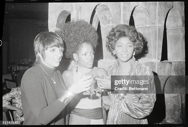 New York: Liza Minnelli and Nancy Wilson toast singer Melba Moore following the latter's opening performance at the Waldorf Astoria's Empire Room in...