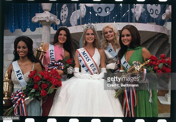 San Juan, Puerto Rico: Tanya Wilson, Miss U.S.A., of Honolulu, wears crown and is surrounded by runners-up in the pageant.
