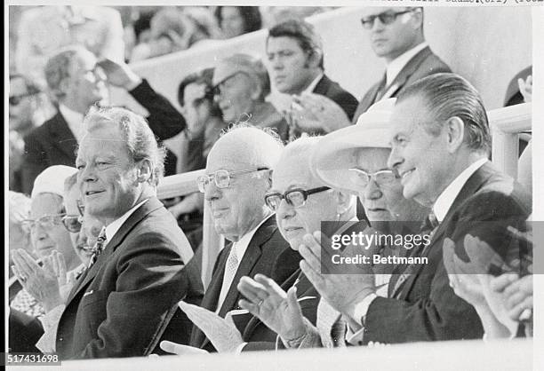 Viewing the opening pageant of the XXth Olympiad from the president's box in Olympic Stadium are West German Chancellor Willy Brandt, International...