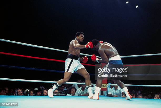Manila, The Philippines: Champion Muhammad Ali lands a right on Joe Frazier's head during the 2nd round. Ali held his title 10/1 defeating Frazier by...