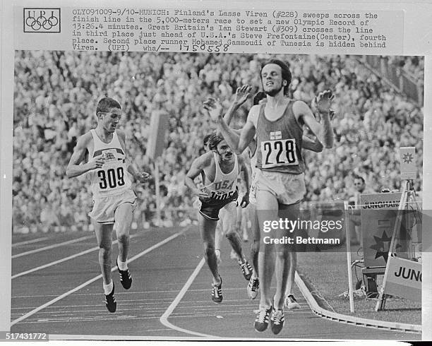 Finland's Lasse Viren, sweeps across the finish line in the 5,000 meters race to set a new Olympic record of 13:26. 4 minutes. Great Britain's Ian...