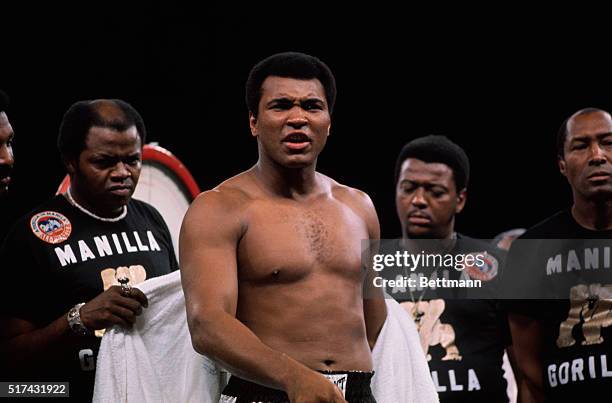 Manila, Philippines- Muhammad Ali horses around at the weigh in before he fights Joe Frazier.