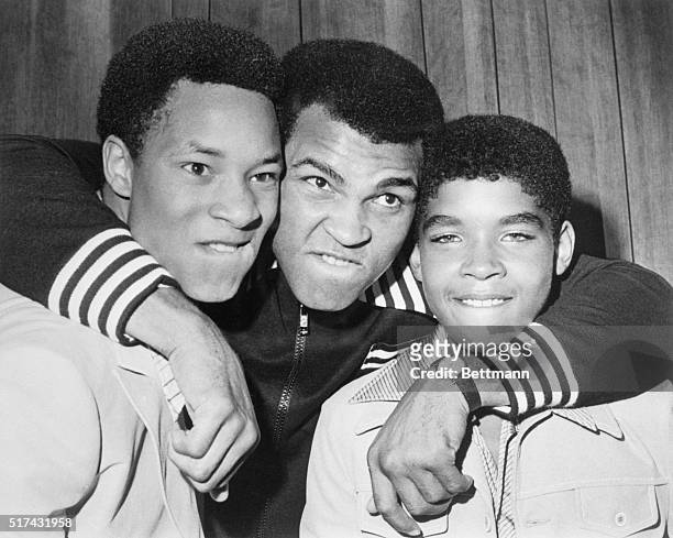New York: "The Greatest." Boxing's world heavyweight champion Muhammad Ali is flanked by Phillip "Chip" McAllister, , and James LeRoy Smith who are...