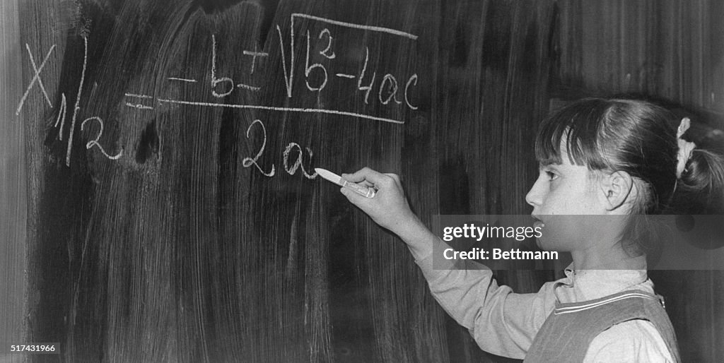 Nadia Comaneci Writing on Blackboard at School