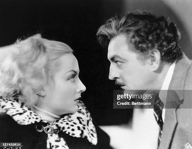 John Barrymore and Carole Lombard are shown in a movie still from "Twetieth Century." Directed by Howard Hawks for Columbia.