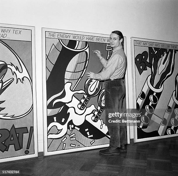 New York, NY- Artist Roy Lichtenstein is shown with a pencil in his hand, as if he is drawing on one of his famous comic-book inspired art works at...