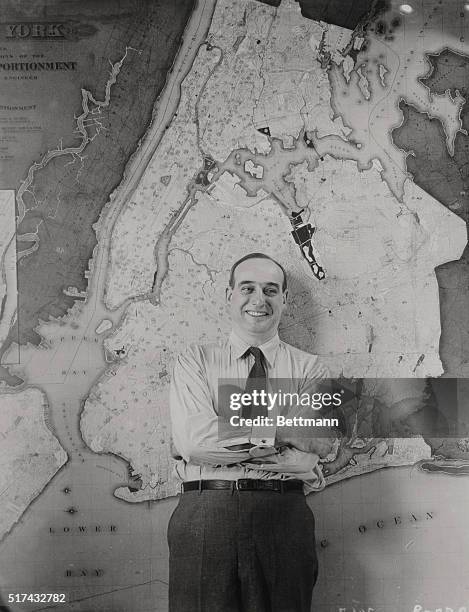 New York, NY-ORIGINAL CAPTION READS:Portrait of New York City Park Commissioner Robert Moses, standing in front of a giant city map at 80 Center...