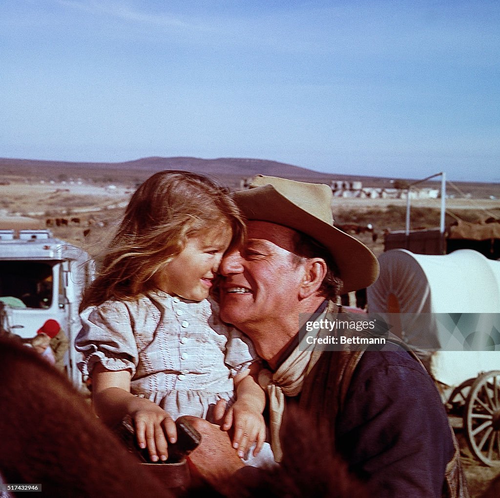 John Wayne and Daughter Aissa on Movie Set
