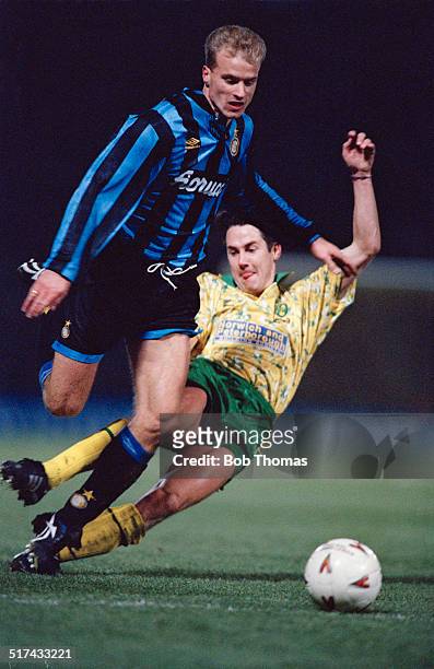 Ian Culverhouse of Norwich City fouls Dennis Bergkamp of Inter Milan during a UEFA Cup Third round First leg match at Carrow Road, Norwich, 24th...