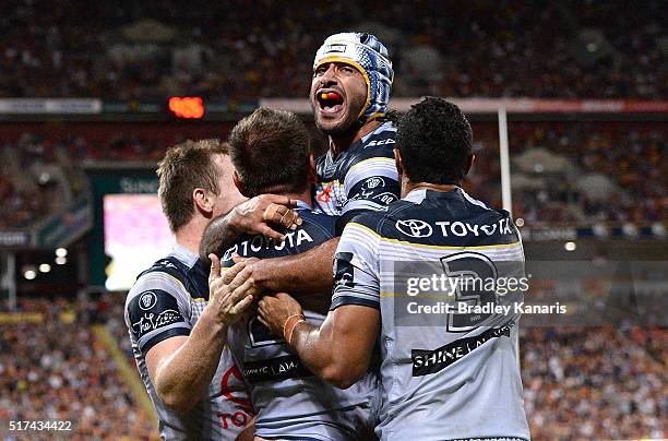 Johnathan Thurston of the Cowboys celebrates but the try is disallowed during the round four NRL match between the Brisbane Broncos and the North...