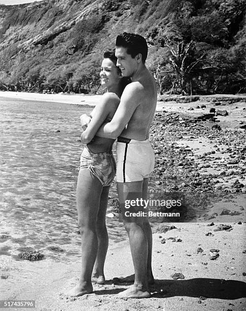 Elvis Presley and Joan Blackman playing the respective roles of Chad Gates and Maile Duval in a romantic beach scene from the 1961 musical comedy...