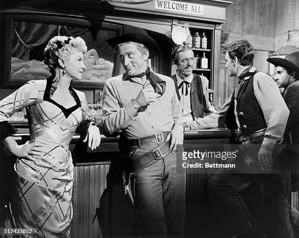 Claire Trevor and Kirk Douglas are shown in Man Without A Star, a 1955 Universal Pictures movie directed by King Vidor.