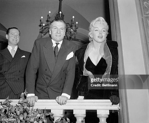 Marilyn Monroe and Lawrence Olivier at the Savoy Hotel for a press conference for The Prince and the Showgirl.
