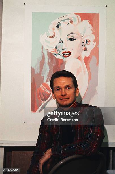 Bob Mackie, leading costume designer, poses with his serigraph of actress Marilyn Monroe at the Far Gallery.