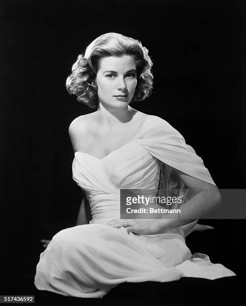 Grace Kelly, movie actress who is to become a princess next month, thinks this photograph of her is "too sexy," according to Paramount photographer...