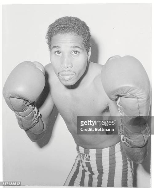 New York, N.Y.:Photo shows former lightweight boxing champion Ismael Laguna, of Panama, working out on punching ball as he goes through training for...
