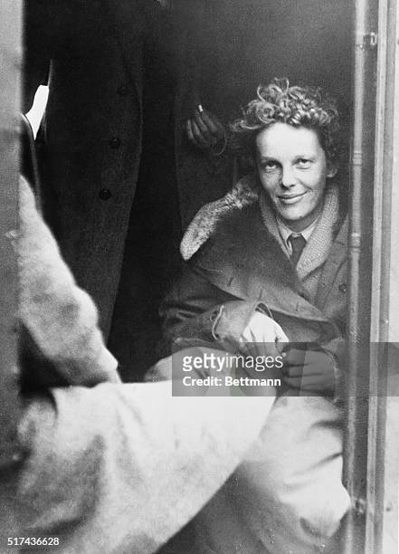 The above exclusive photo shows Miss Amelia Earhart in the plane Friendship on arrival at Burry Port, Carmarthenshire, Wales, after the flight across...