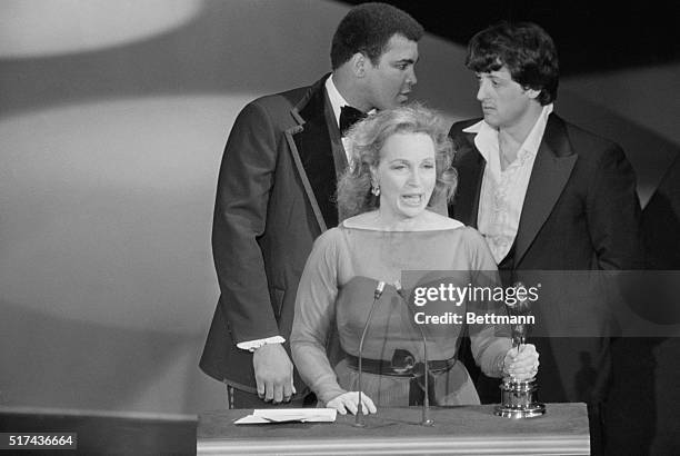 Actress Beatrice Straight makes her acceptance speech for her Best Supporting Actress Oscar for her role in Network, as actor Sylvester Stallone and...