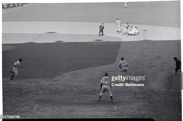 Fast Double Play in Sixth. Bronx, New York, New York: Hitting into a fast double play in the sixth inning, Billy Johnson dashes for first. Play went...