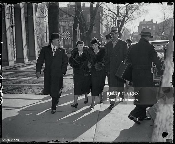 Flemington, N. J.: Returning to the courthouse at noon recess today under the escort of New Jersey State Policemen are left to right, Mrs. Ollie...