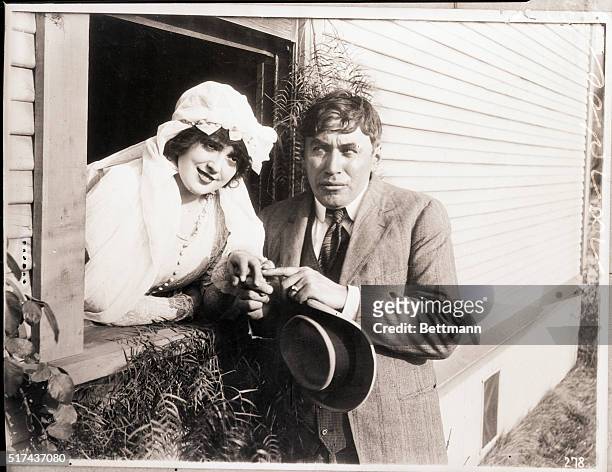 Picture shows actors, Mable Normand and Mack Sennett, members of the Keystone Comedies.