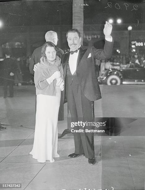 Mr. And Mrs. Warner Oland, well known in the film colony photographed when they attended the Hollywood Premier of the 'House of Rothschild.' Mr....