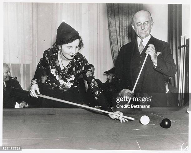 New York: Society Woman Shows Proficiency With Cue. Mrs. F. Bartholomay Jelke, society woman, shows her skill with the cue in a billiard match, as...