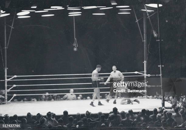 Baer passed out of picture on his knees...This is the scene that 90,000 fight fans watched as the fatal count was tolled over Max Baer in the fourth...