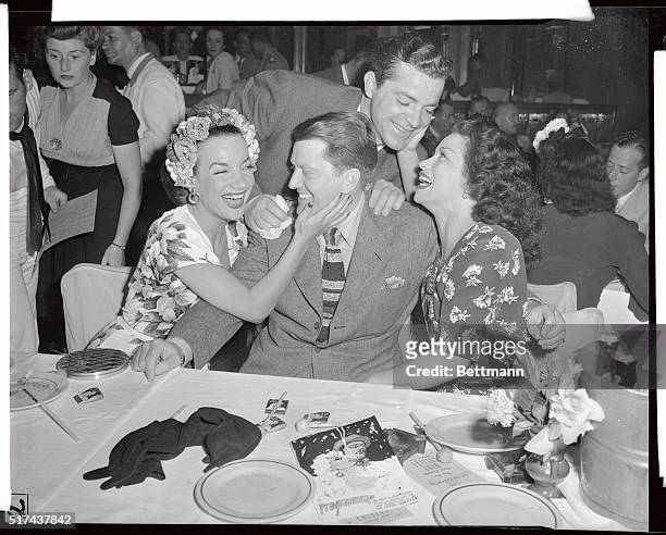 It's a real, gala Broadway welcome, here passed out to screen stars Michael O'Shea and Dana Andrews as they visit the Latin Quarter. The glamorous...
