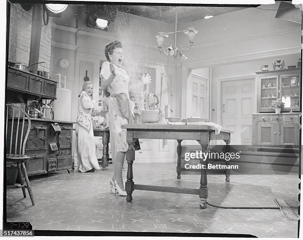Movie star's life is not an easy one. Here 20th Century-Fox actress Sheila Ryan proves that everything is not peaches and cream by taking a shower...