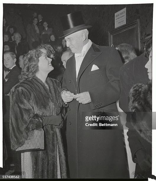 Gold medal winner Eleanor Holm arrives with American financier Bernard Baruch to attend the opening of Kern and Hammerstein's new production of Show...