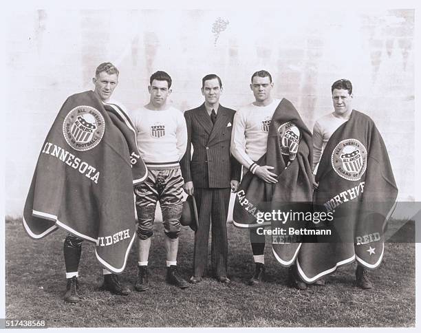 All America Football. San Francisco, California: Members of all East Football Team receive official sweaters and blankets from Christy Walsh, member...