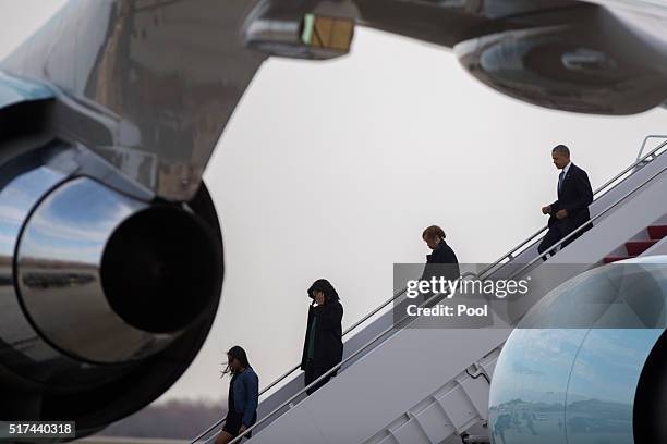 President Barack Obama , with his mother in law Marion Robinson , First Lady Michelle Obama and daughter Sasha , step off Air Force One on March 25,...