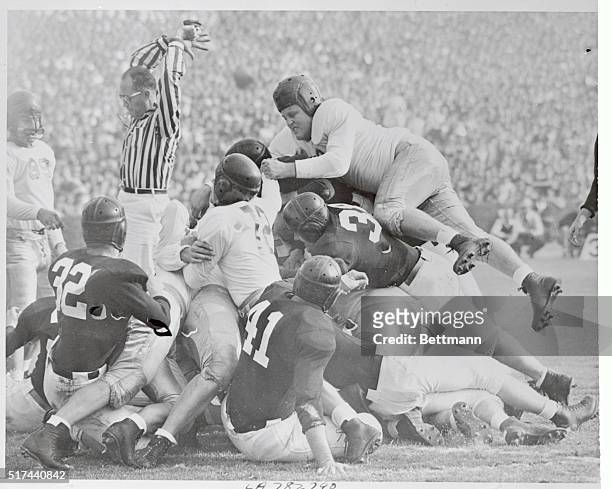 The boys "pile on" as Alabama goes over for a touchdown in the Rose Bowl game on New Year's Day. The University of Southern California bowed to the...