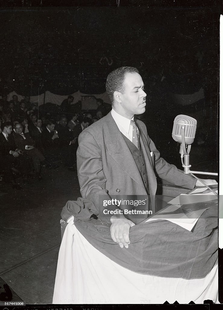 Roy Wilkins Sitting at Microphone