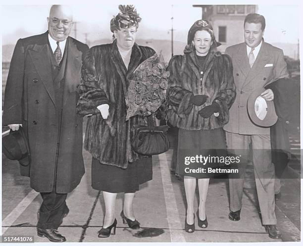 San Francisco, California: Automobile Industry Heads Meet. Mr. And Mrs. Henry Kaiser, and Mr. And Mrs. Henry Ford II arrive in San Francisco after...