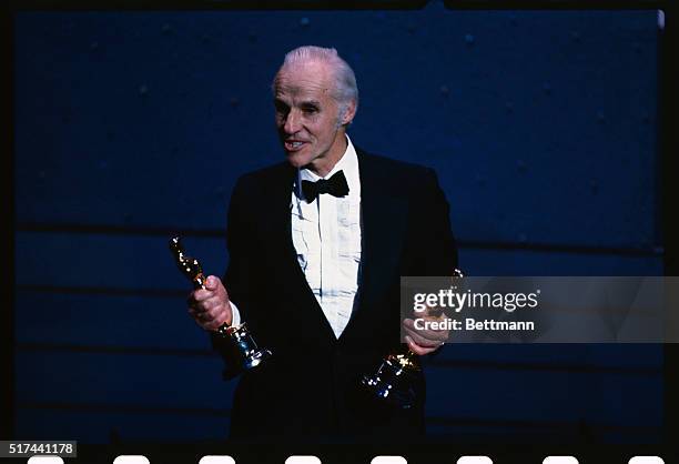 Hollywood, California: Billy Williams holds two Oscars, one for himself and one for Ronnie Taylor, after winning the Best Cinematography Oscar for...