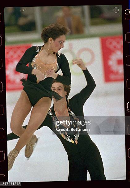 Peter Carruthers tosses his sister Kitty in the air during their free skating routine to win the silver medal in the pairs event 2/12.