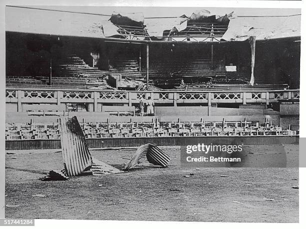 This is how the All England Lawn Tennis Club looked after one of the heavy air raids in 1944. Damage has now been fully repaired and the famed court...