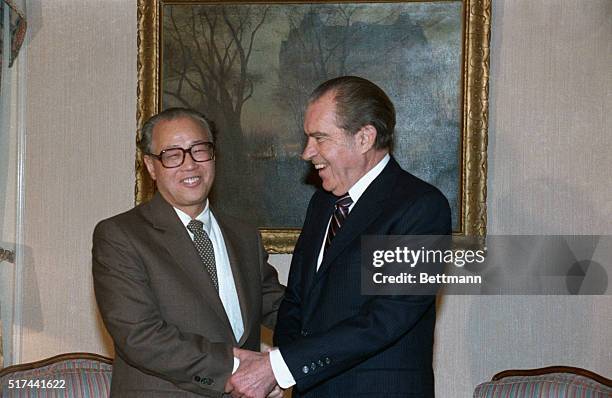 China's Premier Zhao Ziyang and former US President Richard Nixon shake hands as they met 1/16 on last day of Zhao's US visit.